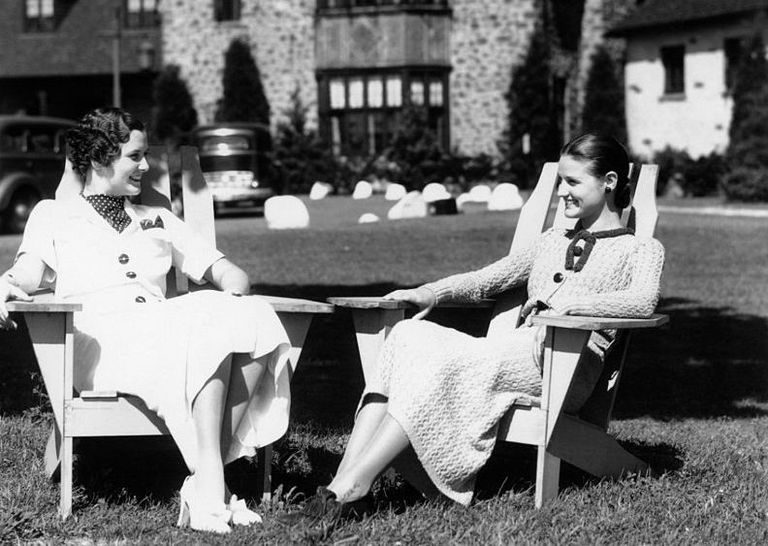 https://www.gettyimages.com/detail/news-photo/1930s-two-women-sitting-in-adirondack-lawn-chairs-in-front-news-photo/563966033?adppopup=true