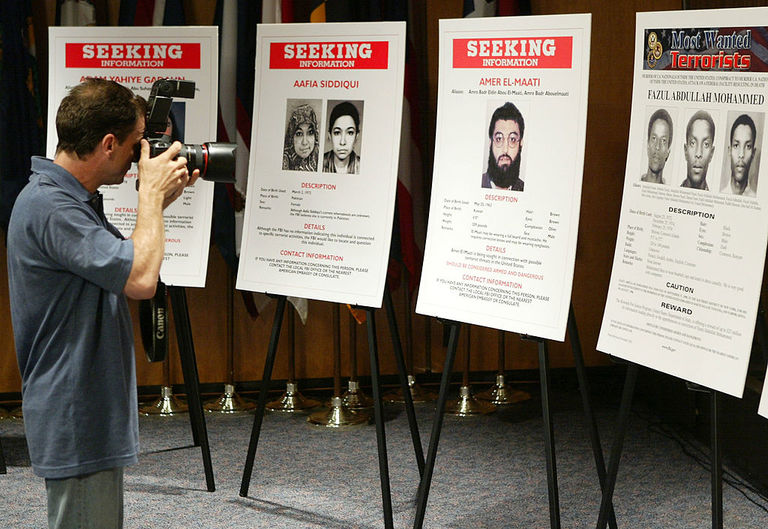 https://www.gettyimages.co.uk/detail/news-photo/photographer-points-his-camera-at-posters-of-suspected-al-news-photo/50899487