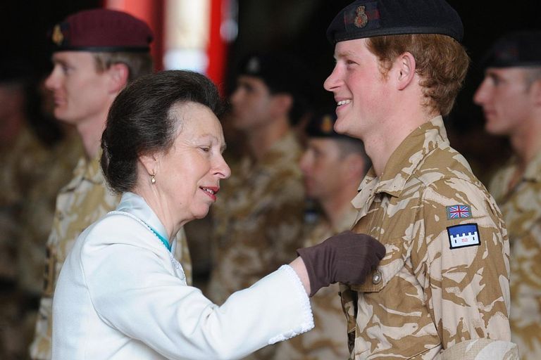 Princess Anne giving Prince Harry a medal