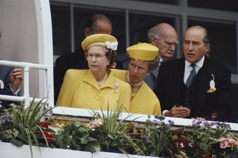 The Queen and Princess Anne watching a horse race