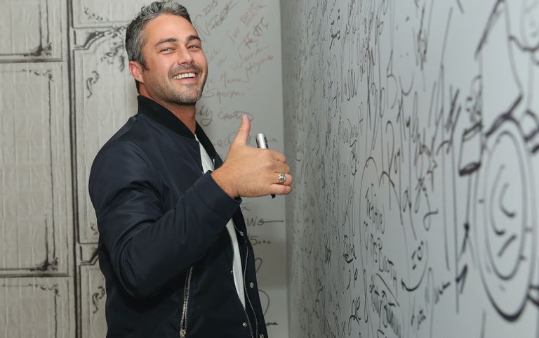 https://www.gettyimages.com/detail/news-photo/actor-taylor-kinney-signs-the-wall-at-aol-studios-when-he-news-photo/493366022?adppopup=true