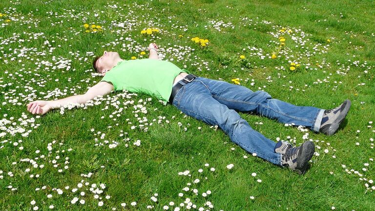 man lying on the grass