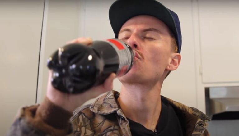 man drinking coke
