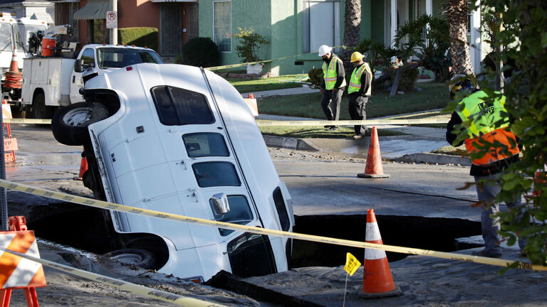 A van fell into a sinkhole