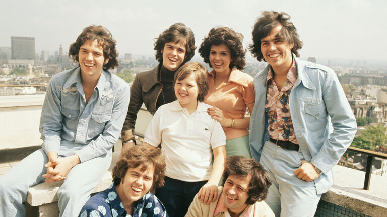 Group portrait of the Osmonds. Left to right are (back) Merrill, Donny, Marie and Jay, (front) Alan, Jimmy and Wayne in London, England in the 1970's