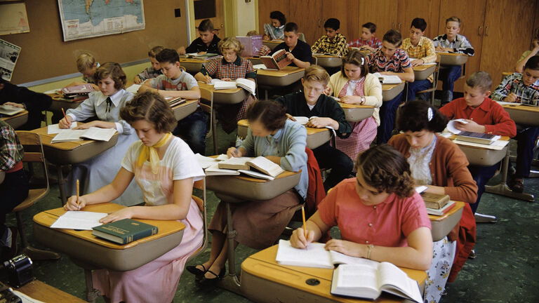 High School Students Writing at Desks