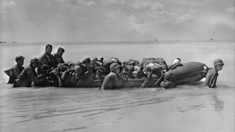 https://www.gettyimages.co.uk/detail/news-photo/marines-wounded-in-the-landing-on-tarawa-are-towed-out-to-news-photo/1314551443