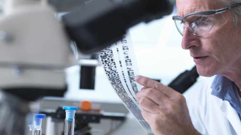 Researcher holding a DNA
