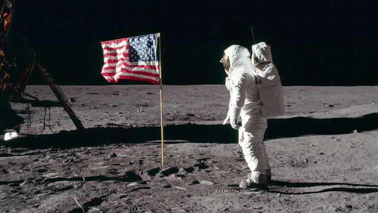 Buzz salutes the U.S. Flag