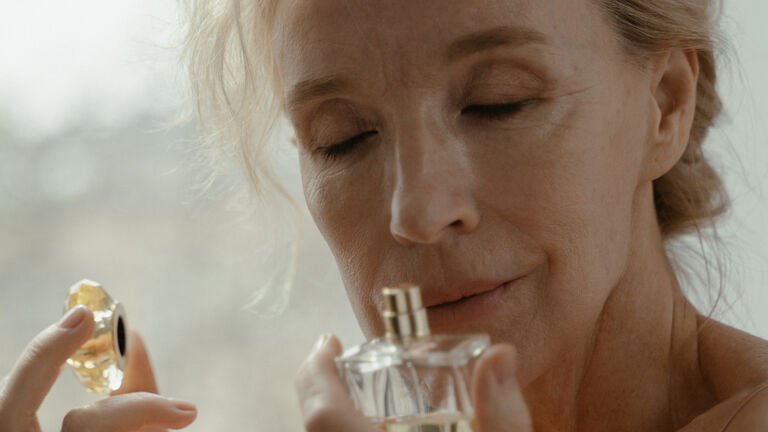 woman smelling perfume