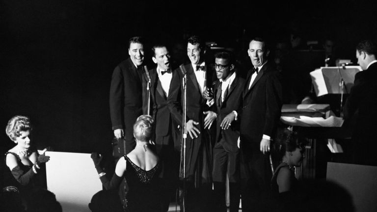 Peter Lawford, Frank Sinatra, Dean Martin, Sammy Davis Jr., and Joey Bishop performing