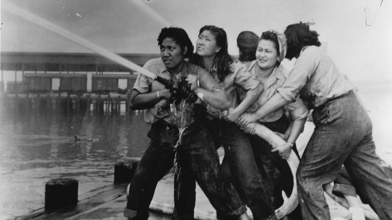 Women fire fighters during a training exercise at the Pearl Harbor Naval Shipyard, during World War II