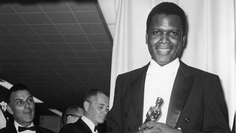 Sidney Poitier holds his Best Actor Oscar