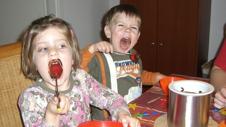 kids eating chocolate strawberry