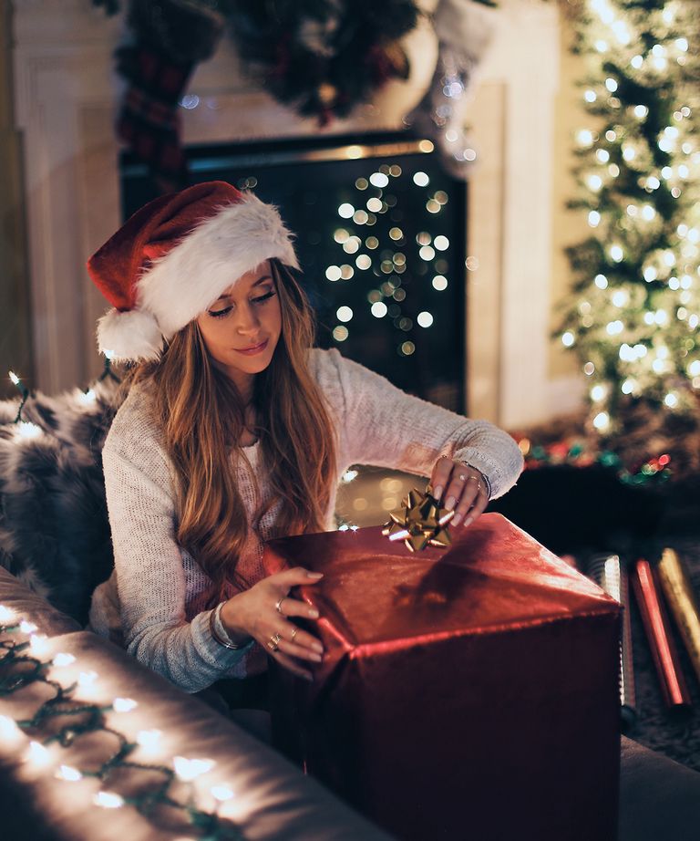 woman wrapping gift