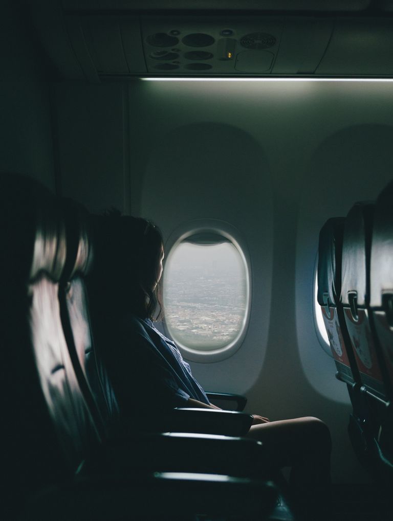 woman by an airplane window