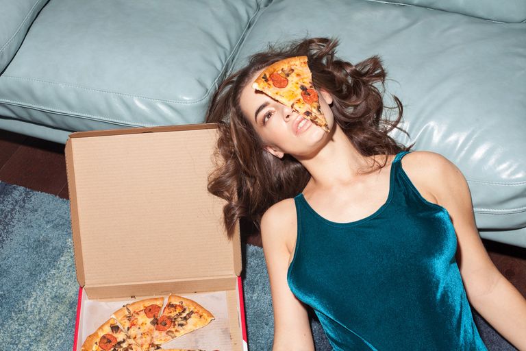 female with pizza