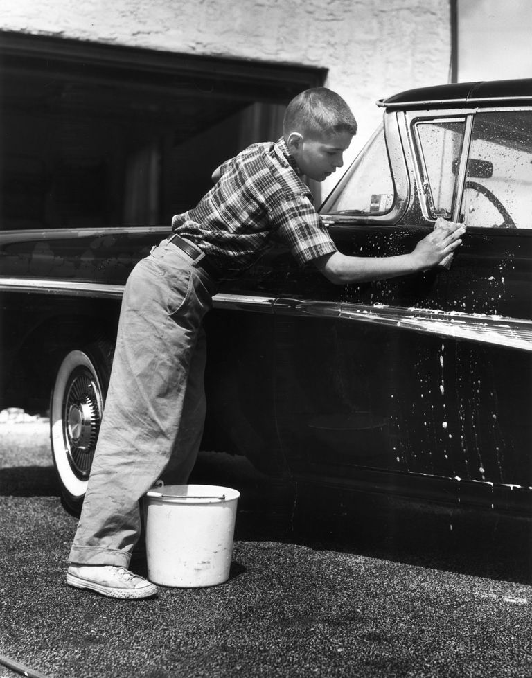 boy washes car