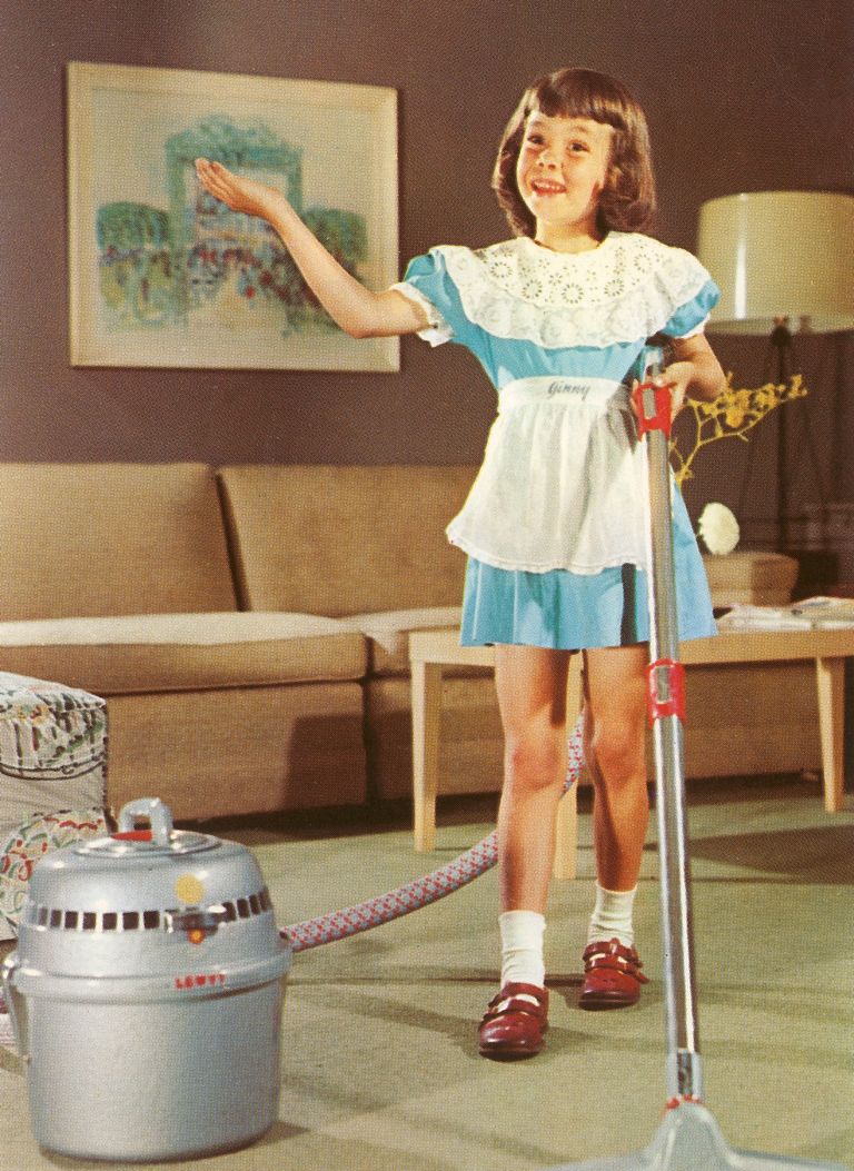 young girl vacuuming