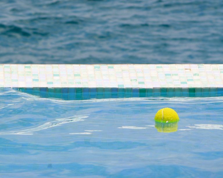 tennis ball on swimming pool