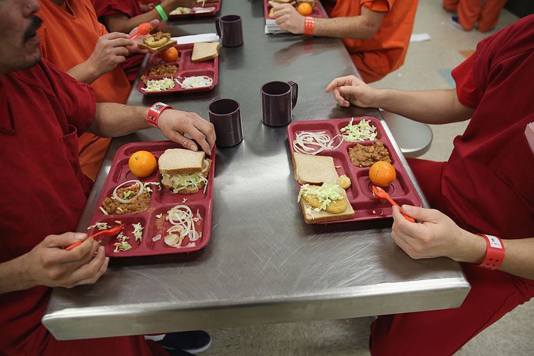https://www.gettyimages.com/detail/news-photo/immigrant-detainees-eat-lunch-one-of-three-meals-a-day-at-news-photo/450371199