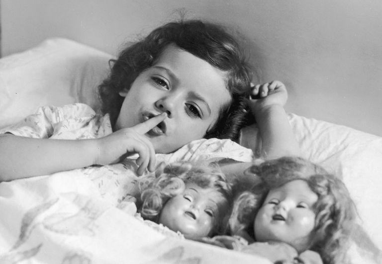 https://www.gettyimages.co.uk/detail/news-photo/headshot-of-a-young-girl-laying-in-bed-with-two-baby-dolls-news-photo/3227195 young girl shushing