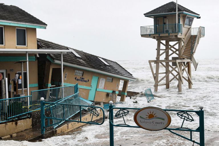 https://www.gettyimages.co.uk/detail/news-photo/waves-crash-near-a-damaged-building-and-a-lifeguard-tower-news-photo/1244655635