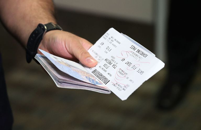 https://www.gettyimages.com/detail/news-photo/passenger-holds-his-passport-and-ticket-at-the-fort-news-photo/598045308?phrase=us%20passportJoe Raedle/Getty Images