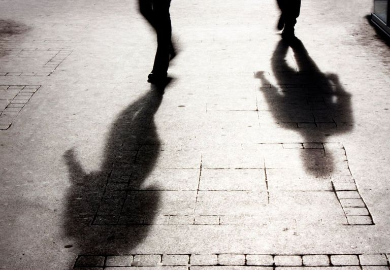 https://www.gettyimages.com/detail/photo/shadow-of-a-man-on-patterened-sidewalk-royalty-free-image/658863276?phrase=man%20being%20followed&adppopup=true