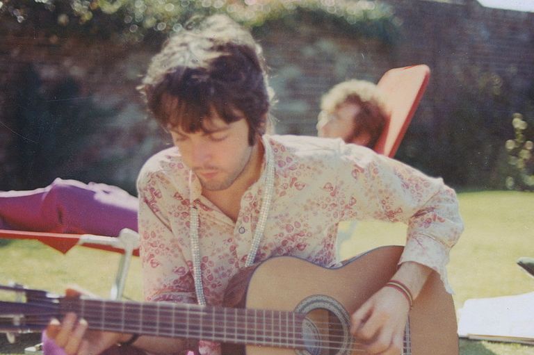 https://www.gettyimages.co.uk/detail/news-photo/paul-mccartney-from-the-beatles-plays-an-acoustic-guitar-news-photo/460188963?adppopup=true