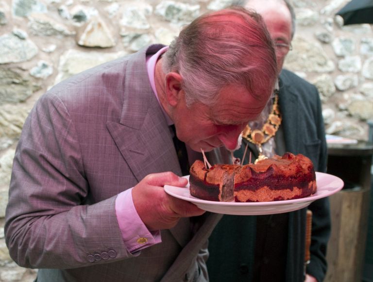 https://www.gettyimages.com/detail/news-photo/prince-charles-prince-of-wales-is-offered-a-piece-of-pork-news-photo/147692472?phrase=charles%20pie&adppopup=true