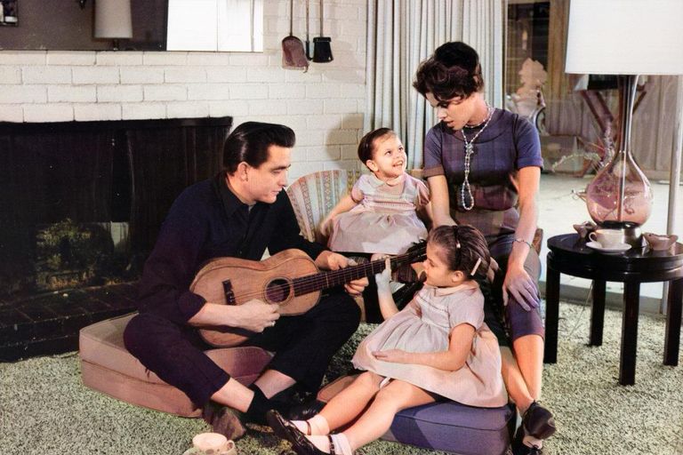 https://www.gettyimages.co.uk/detail/news-photo/country-singer-songwriter-johnny-cash-holds-a-guitar-as-his-news-photo/74256047