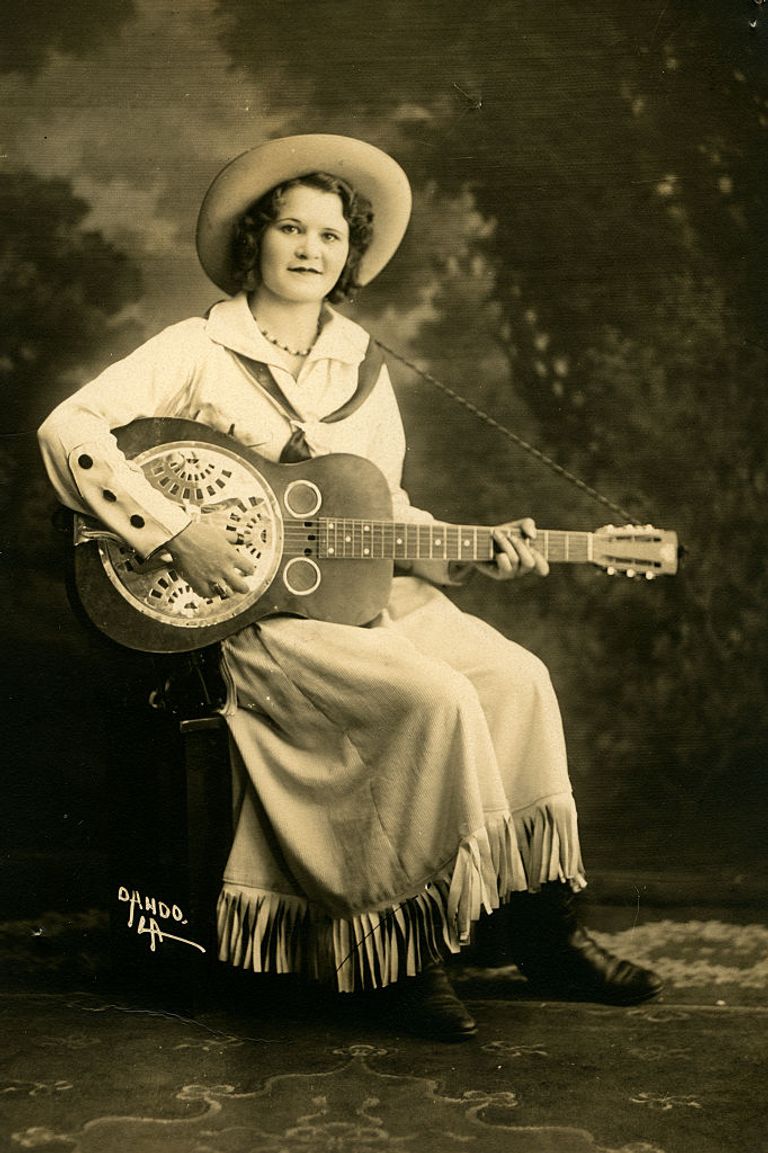 https://www.gettyimages.com/detail/news-photo/photo-postcard-of-a-woman-in-traditional-cowgirl-attire-news-photo/523545450?phrase=wild%20west%20woman&adppopup=true