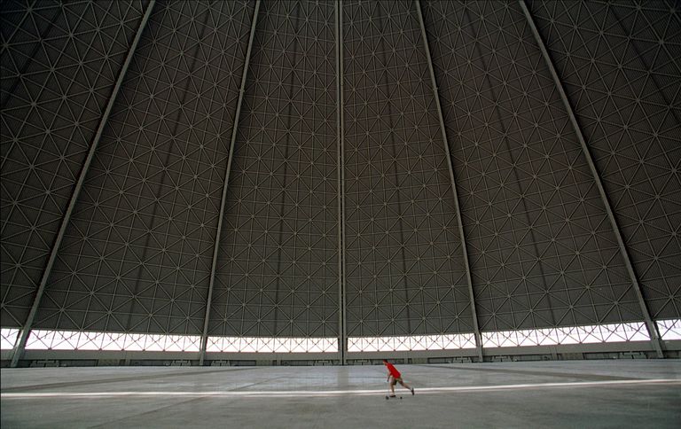 https://www.gettyimages.co.uk/detail/news-photo/worker-uses-a-scooter-to-cross-the-vast-floor-of-the-news-photo/1161614 largest aircraft hangar