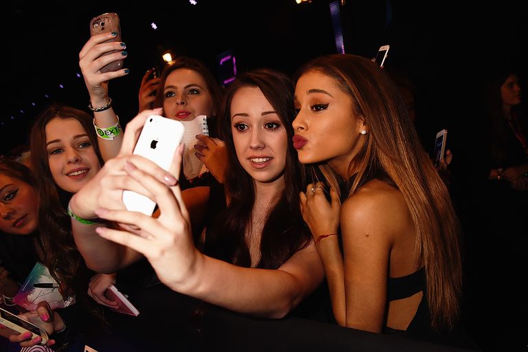 https://www.gettyimages.com/detail/news-photo/ariana-grande-takes-a-selfie-with-a-fan-as-she-attends-the-news-photo/458696360