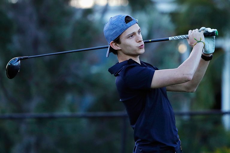https://www.gettyimages.com/detail/news-photo/actor-tom-holland-plays-a-shot-during-a-practice-round-news-photo/1079623166