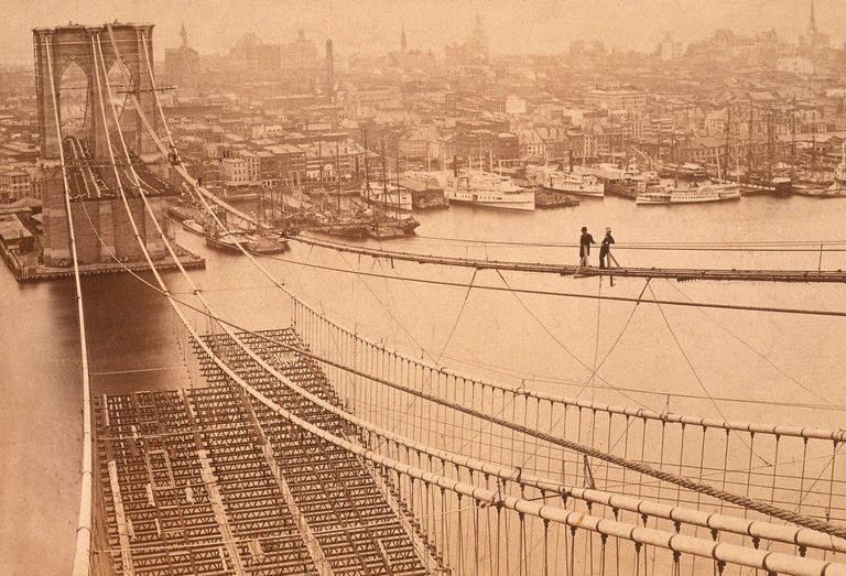 https://www.gettyimages.co.uk/detail/news-photo/high-angle-view-of-two-men-standing-on-a-high-catwalk-news-photo/3231329 Brooklyn Bridge construction