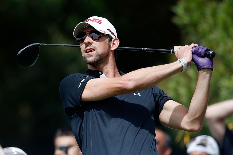 https://www.gettyimages.com/detail/news-photo/olympic-gold-medalist-michael-phelps-hits-a-tee-shot-during-news-photo/165873657
