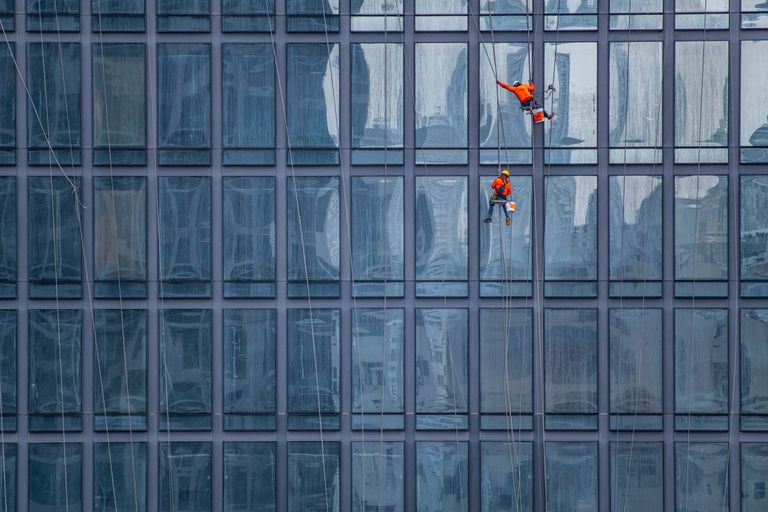 https://www.gettyimages.co.uk/detail/photo/window-cleaners-working-on-facade-of-high-rise-royalty-free-image/1316468512 window cleaners