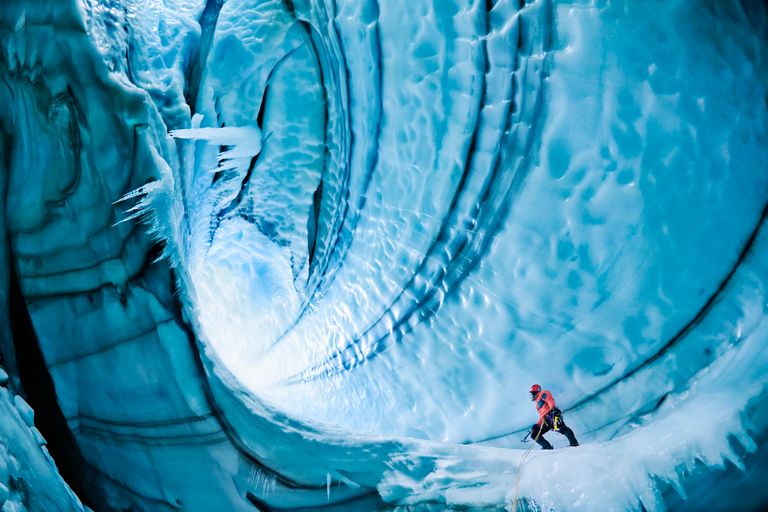 https://www.gettyimages.co.uk/detail/photo/male-ice-climber-exploring-ice-cave-low-angle-view-royalty-free-image/200191338-001?phrase=cave%20exploration&adppopup=true