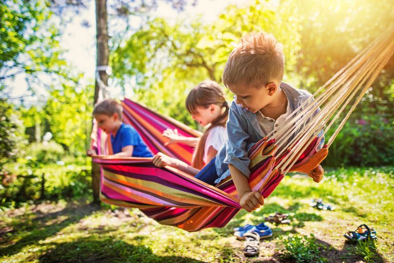 https://www.gettyimages.co.uk/detail/photo/kids-playing-on-hammock-in-the-garden-royalty-free-image/639700700