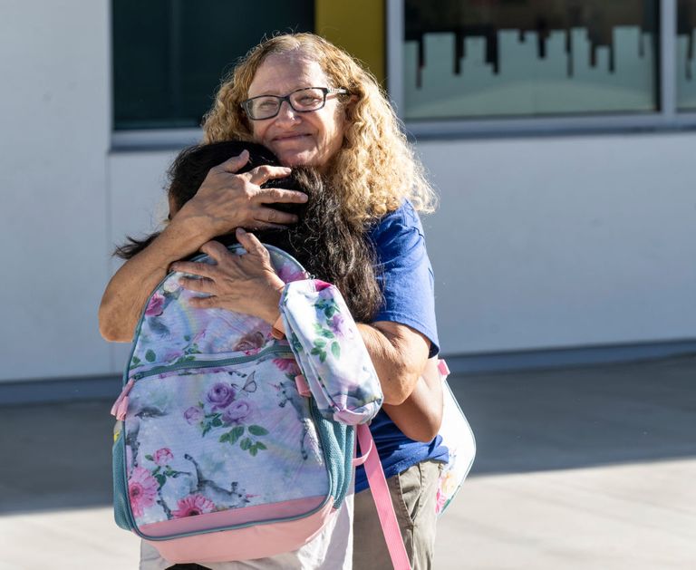 https://www.gettyimages.com/detail/news-photo/teacher-and-student-hug-during-the-first-day-of-school-at-news-photo/1414298958?adppopup=true