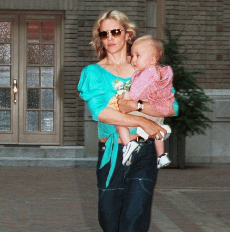 https://www.gettyimages.co.uk/detail/news-photo/madonna-carries-her-son-rocco-as-they-leave-their-apartment-news-photo/1608215