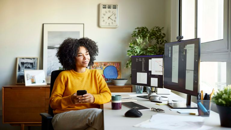 https://www.gettyimages.co.uk/detail/photo/young-businesswoman-working-at-home-office-royalty-free-image/1369567919