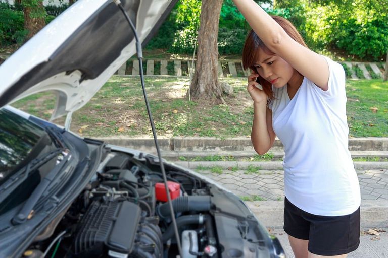 https://www.gettyimages.com/detail/photo/stressed-woman-calling-for-help-on-phone-with-car-royalty-free-image/609037406?phrase=opening+car+hood&adppopup=true