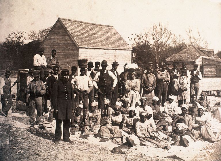 https://www.gettyimages.com/detail/news-photo/group-of-freed-slaves-gather-on-the-plantation-of-news-photo/615304338