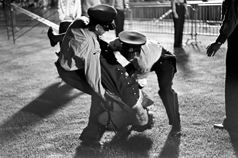 https://www.gettyimages.co.uk/detail/news-photo/an-injured-fan-is-carried-from-the-crowd-during-the-beatles-news-photo/1450369861?adppopup=true