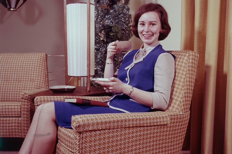 https://www.gettyimages.com/detail/news-photo/young-woman-sitting-on-sofa-drinking-tea-news-photo/671678645
