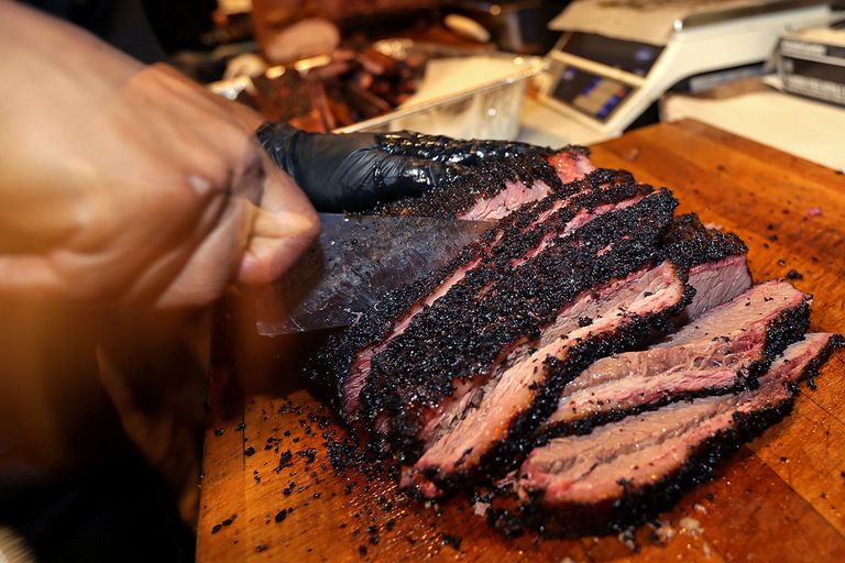 https://www.gettyimages.com/detail/news-photo/beef-brisket-is-sliced-to-order-for-a-customer-at-killens-news-photo/634398812