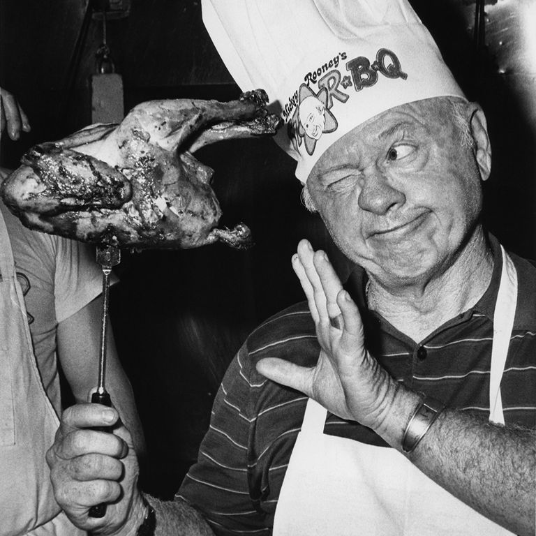 https://www.gettyimages.com/detail/news-photo/actor-mickey-rooney-sizes-up-a-barbecued-chicken-during-news-photo/110609366